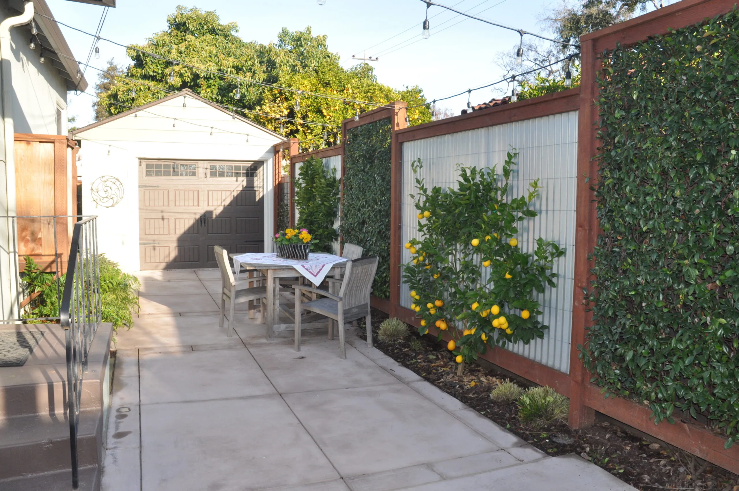 Picture of Koch & Associates turned this unused driveway into a shady gathering place. - Koch & Associates, Inc.