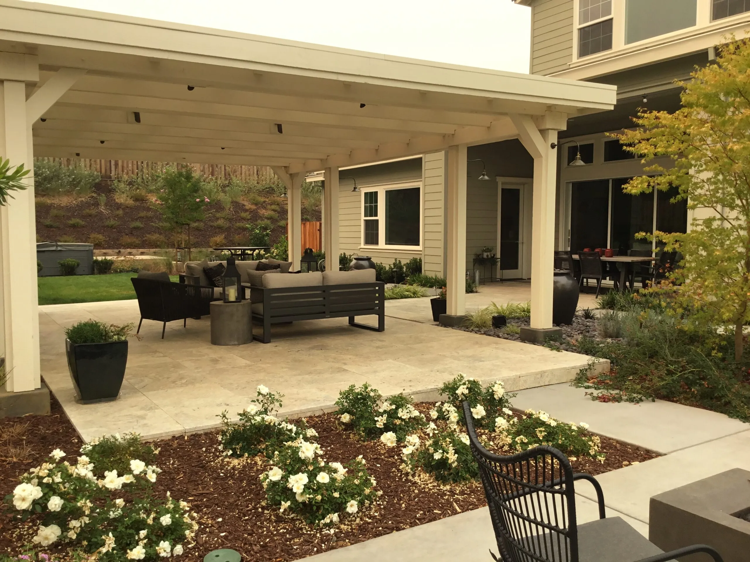 Picture of This arbor (with a solid Polygal roof) provides lots of room for dining and entertaining. - Koch & Associates, Inc.