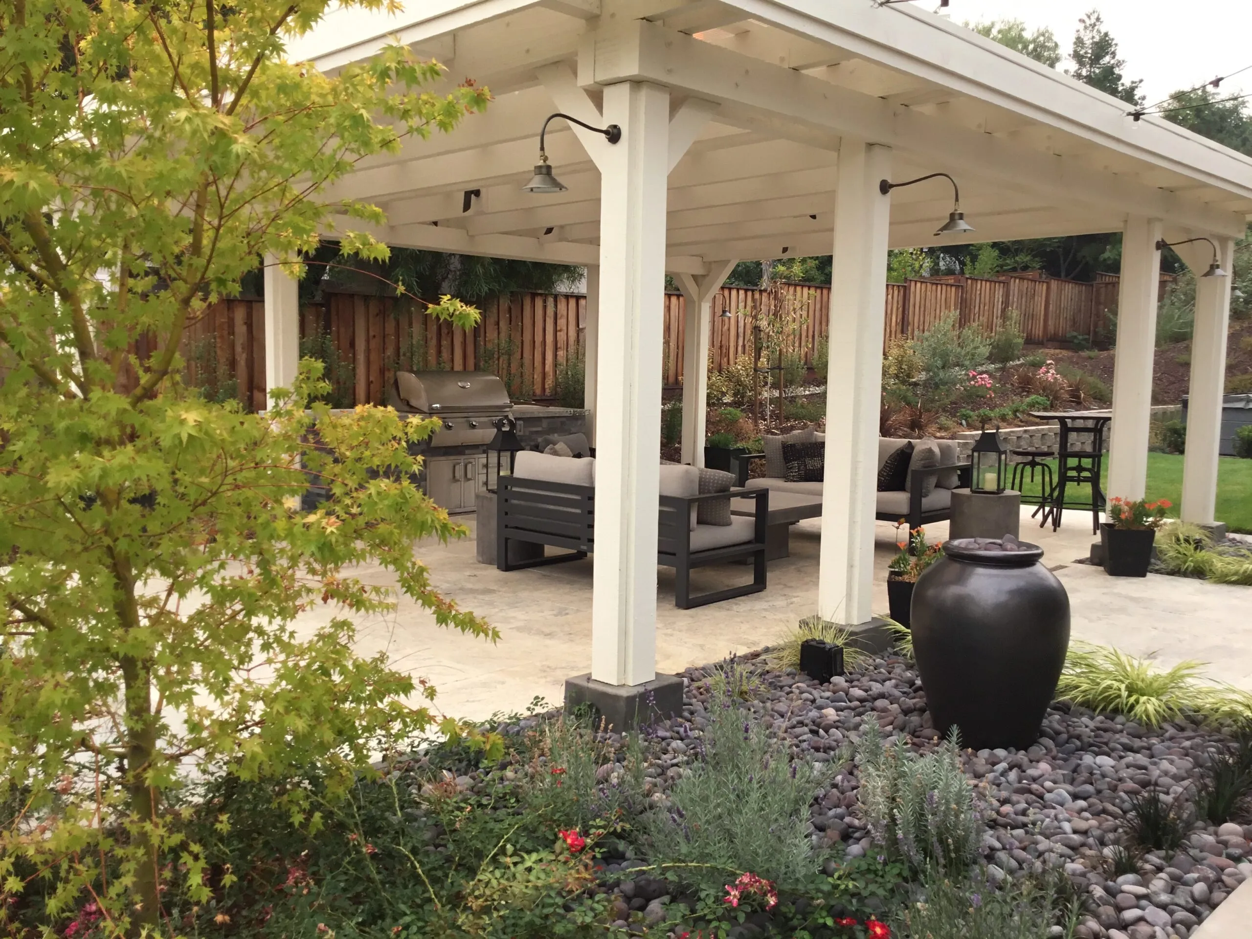 Picture of Koch & Associates installed this arbor to provide shade for the barbecue and a water feature to add a peaceful sound. - Koch & Associates, Inc.