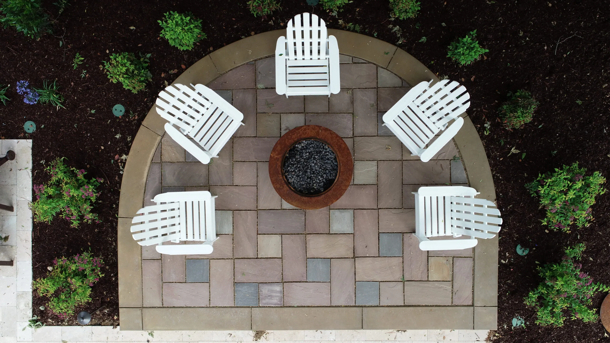 Picture of A bird's-eye view of a stone patio with a fire pit - Koch & Associates, Inc.