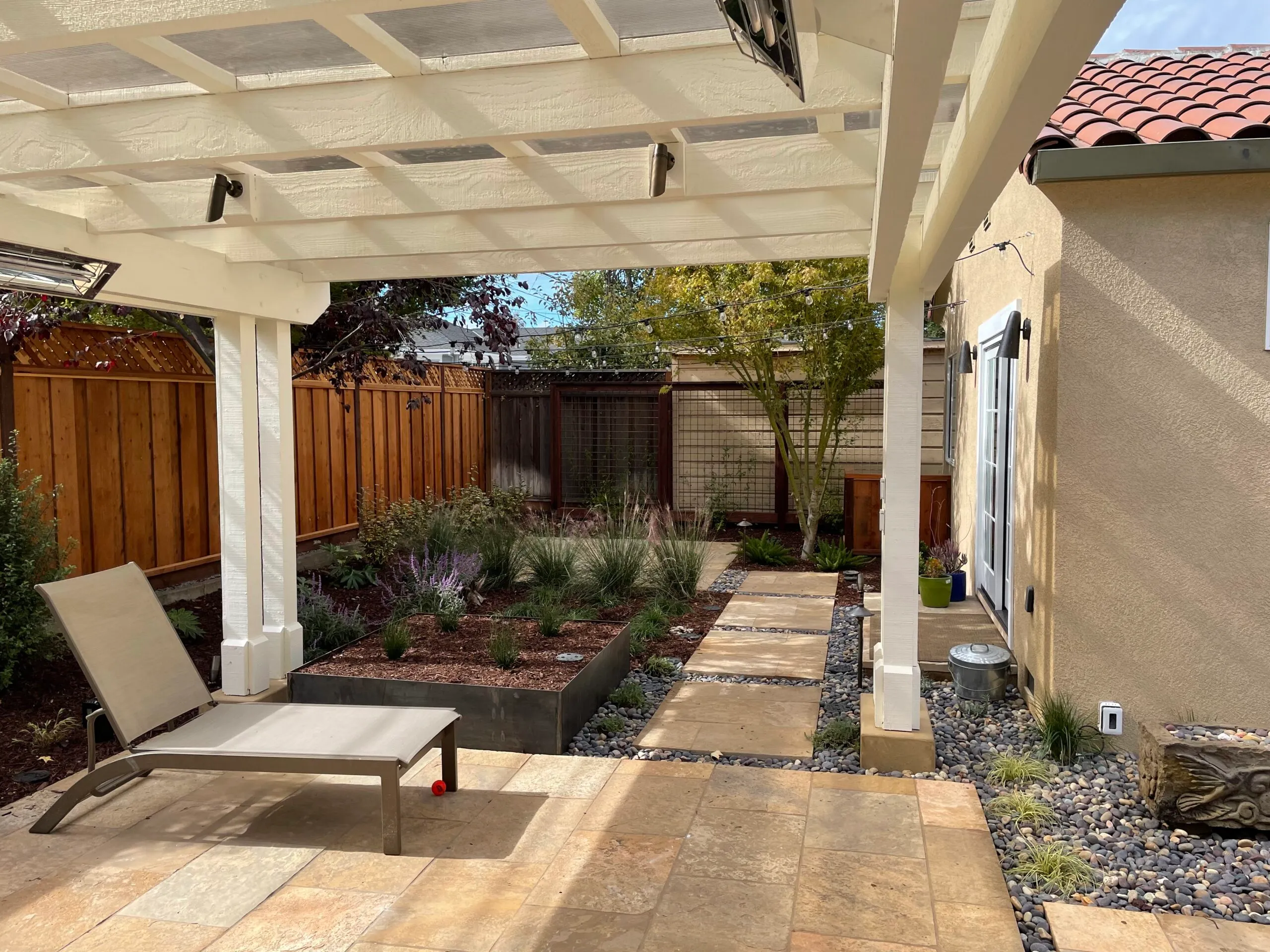 Picture of Koch & Associates designed this small backyard to accommodate lots of features. - Koch & Associates, Inc.