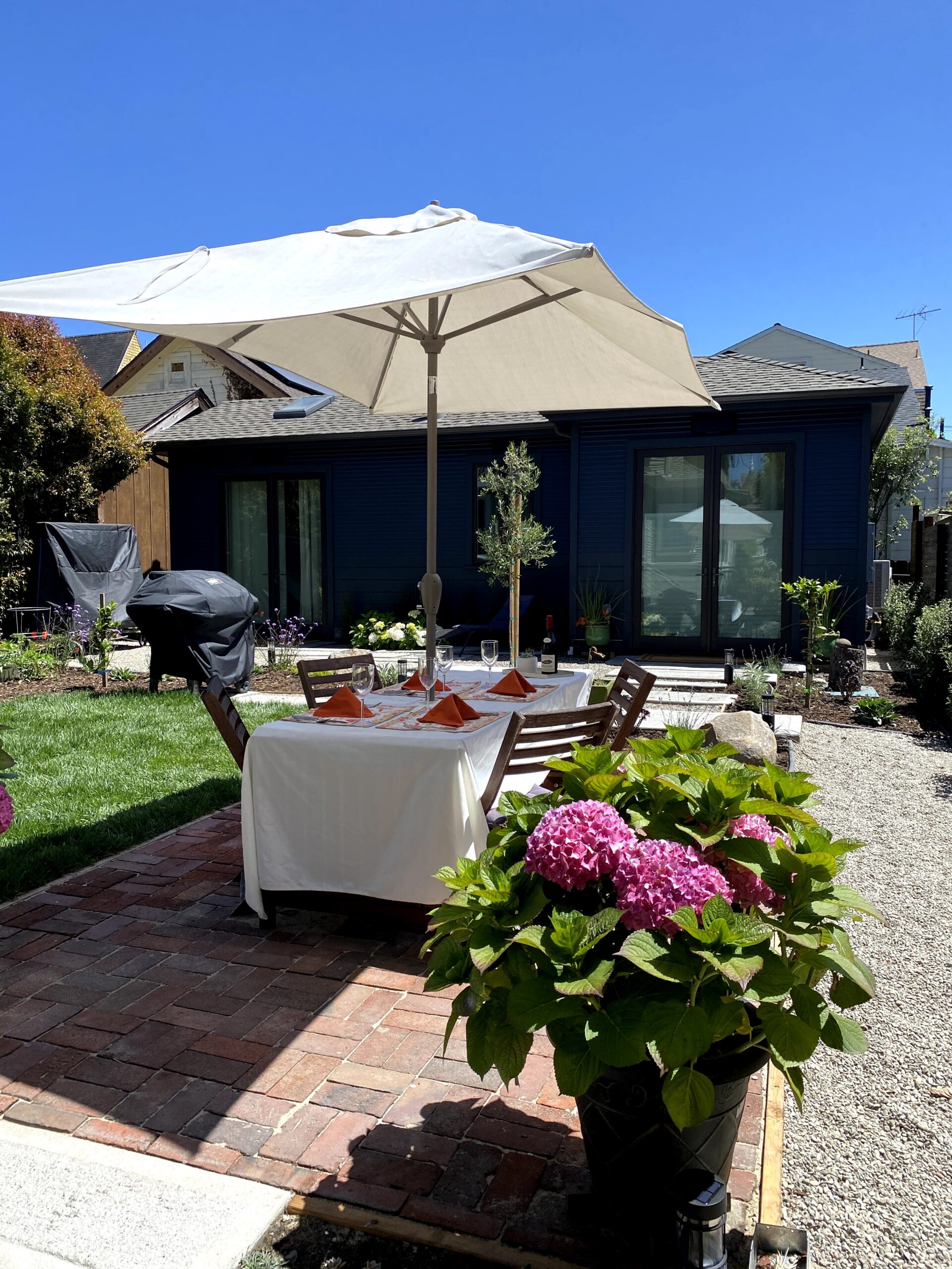 Picture of This exterior remodeling project features an outdoor sitting area. - Green Living Builders LLC