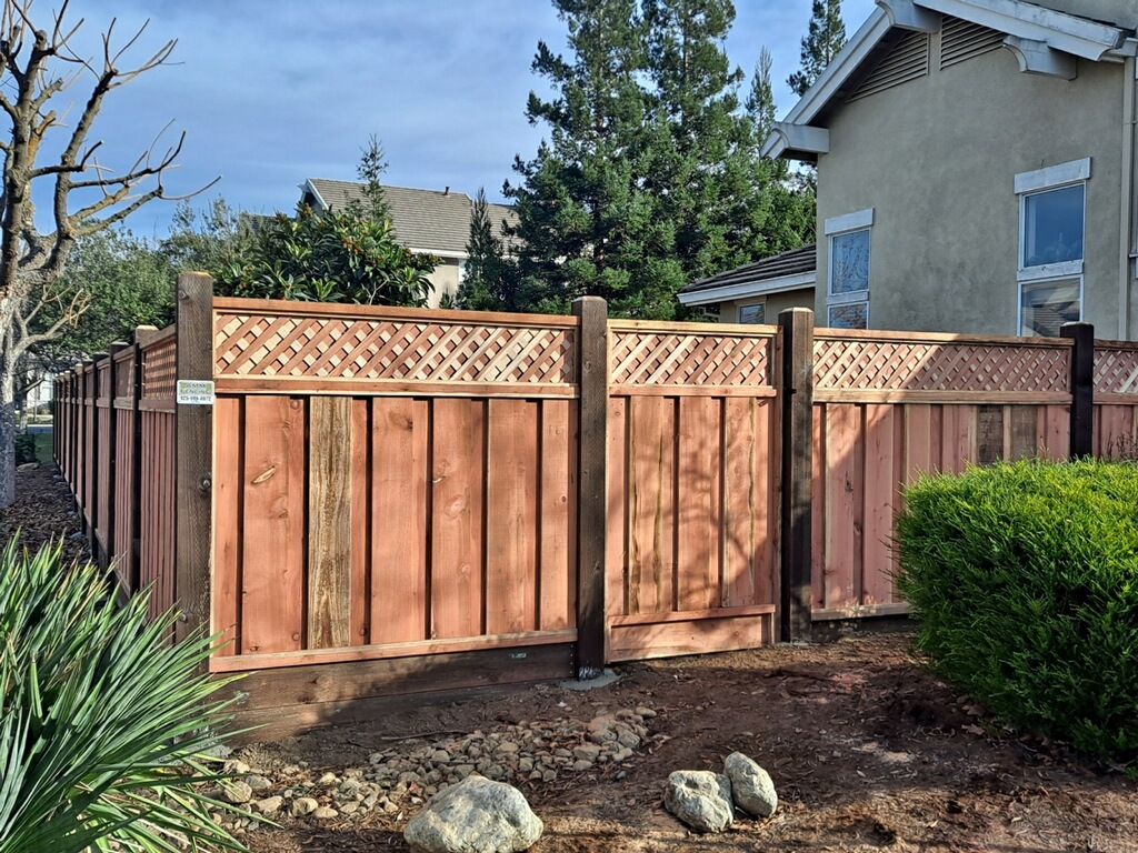 Picture of This privacy-style redwood fence features thicker lattice than is normally found at big-box home improvement stores. - AMM Fencing