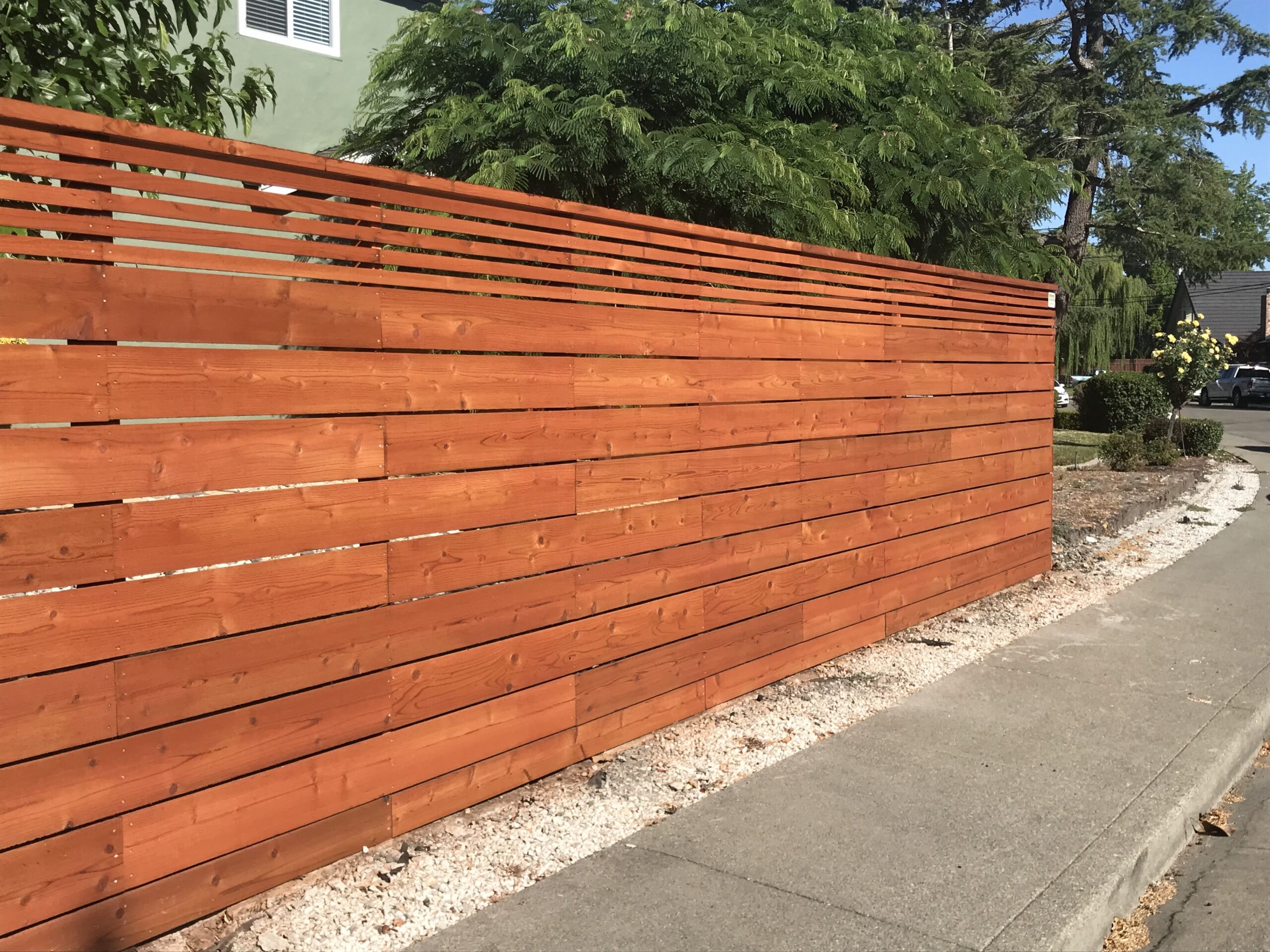 Picture of Ipe and Batu (aka Indonesian mahogony) are popular woods for horizontal fences like this one. - AMM Fencing