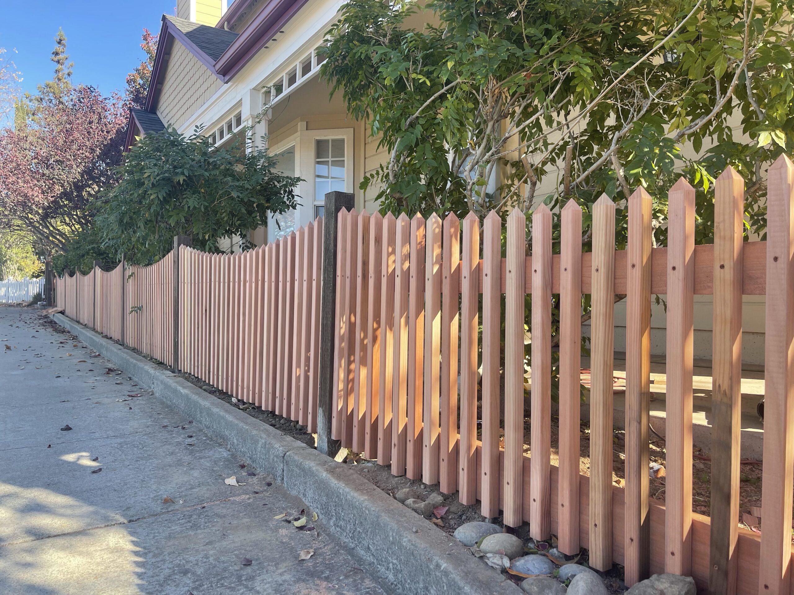 Picture of A recent redwood picket fence installation by AMM Fencing - AMM Fencing