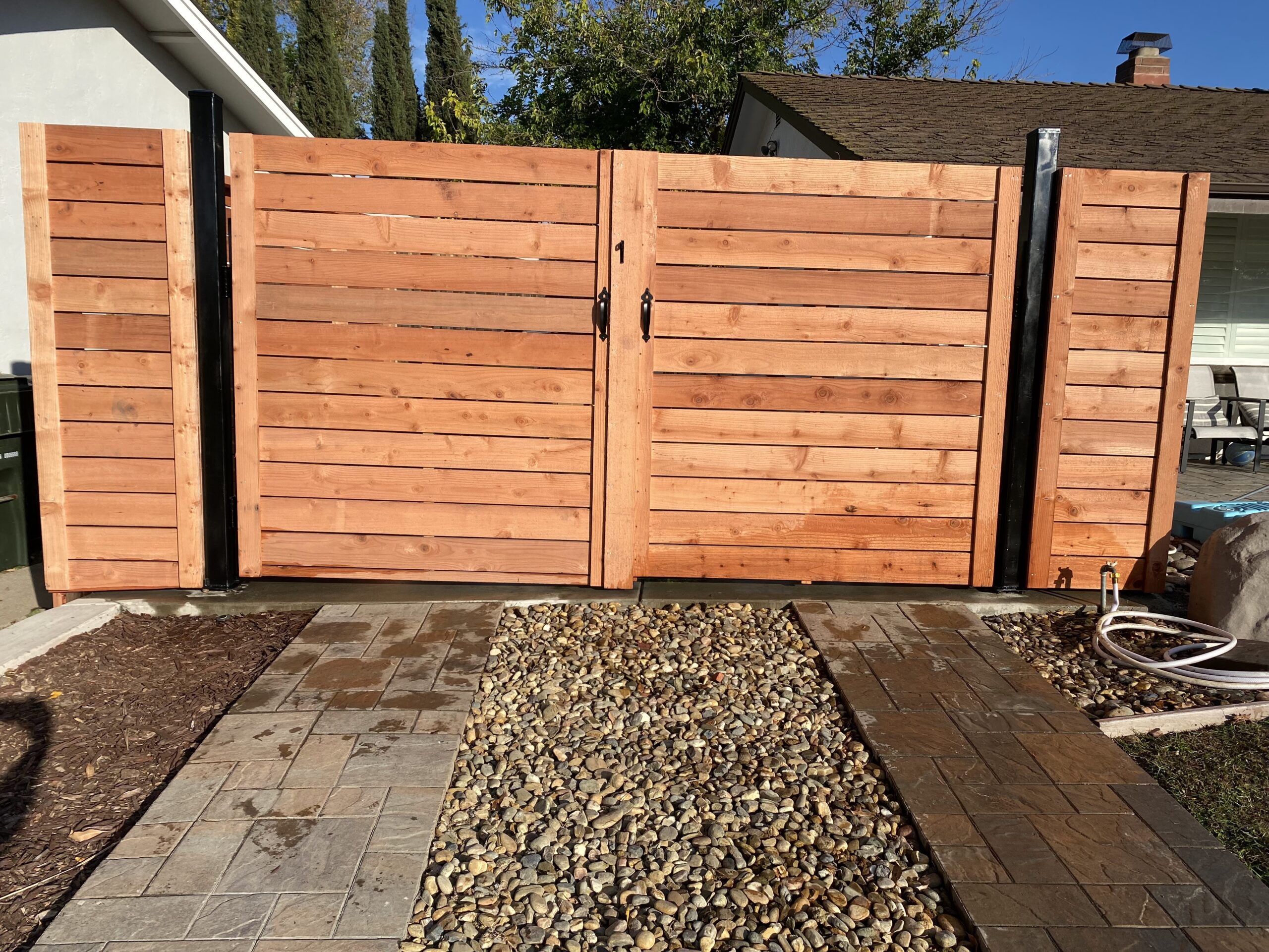 Picture of AMM Fencing installed this horizontal redwood gate. - AMM Fencing