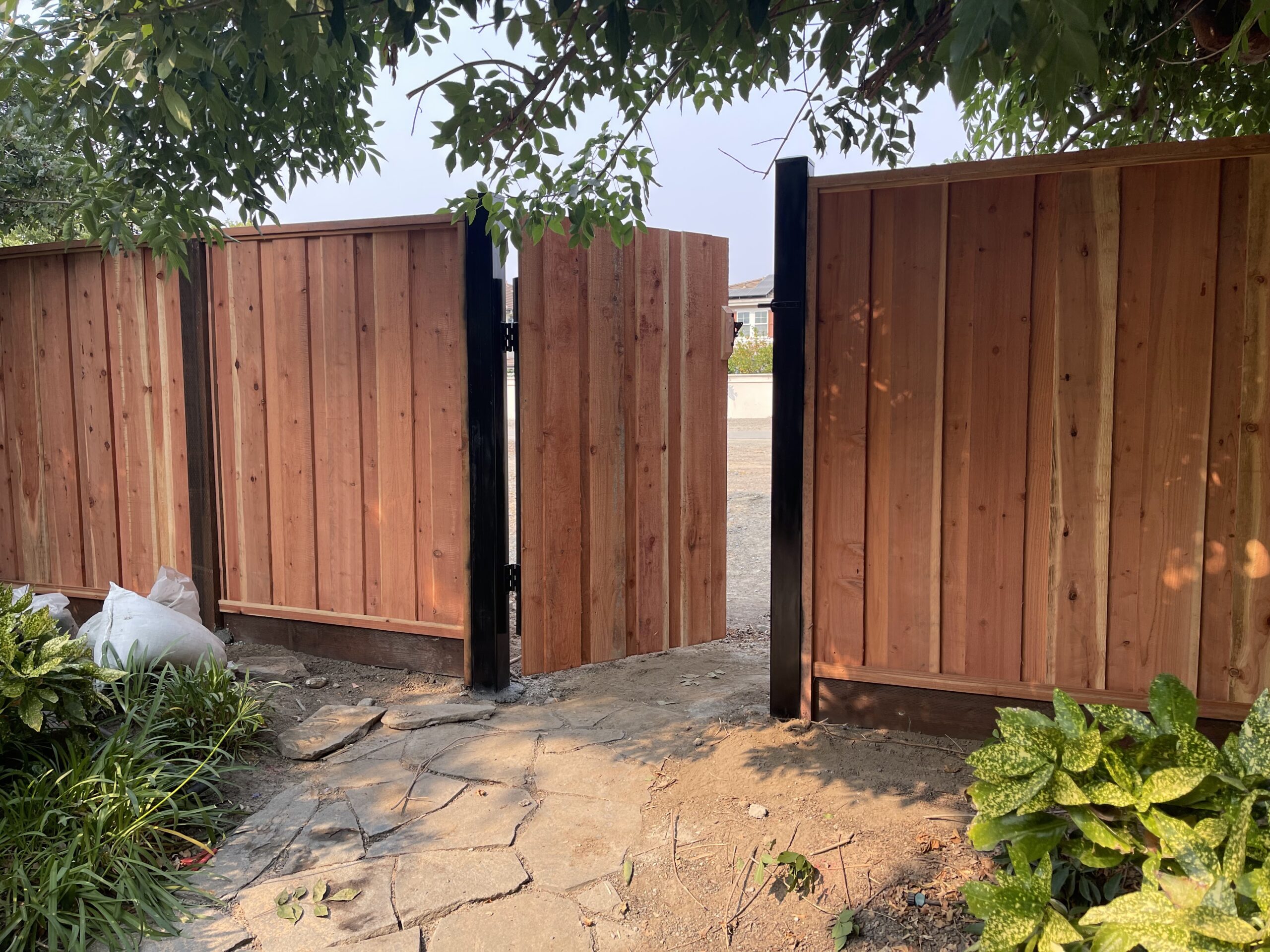 Picture of AMM Fencing installed this “metal frame and post” redwood gate. - AMM Fencing