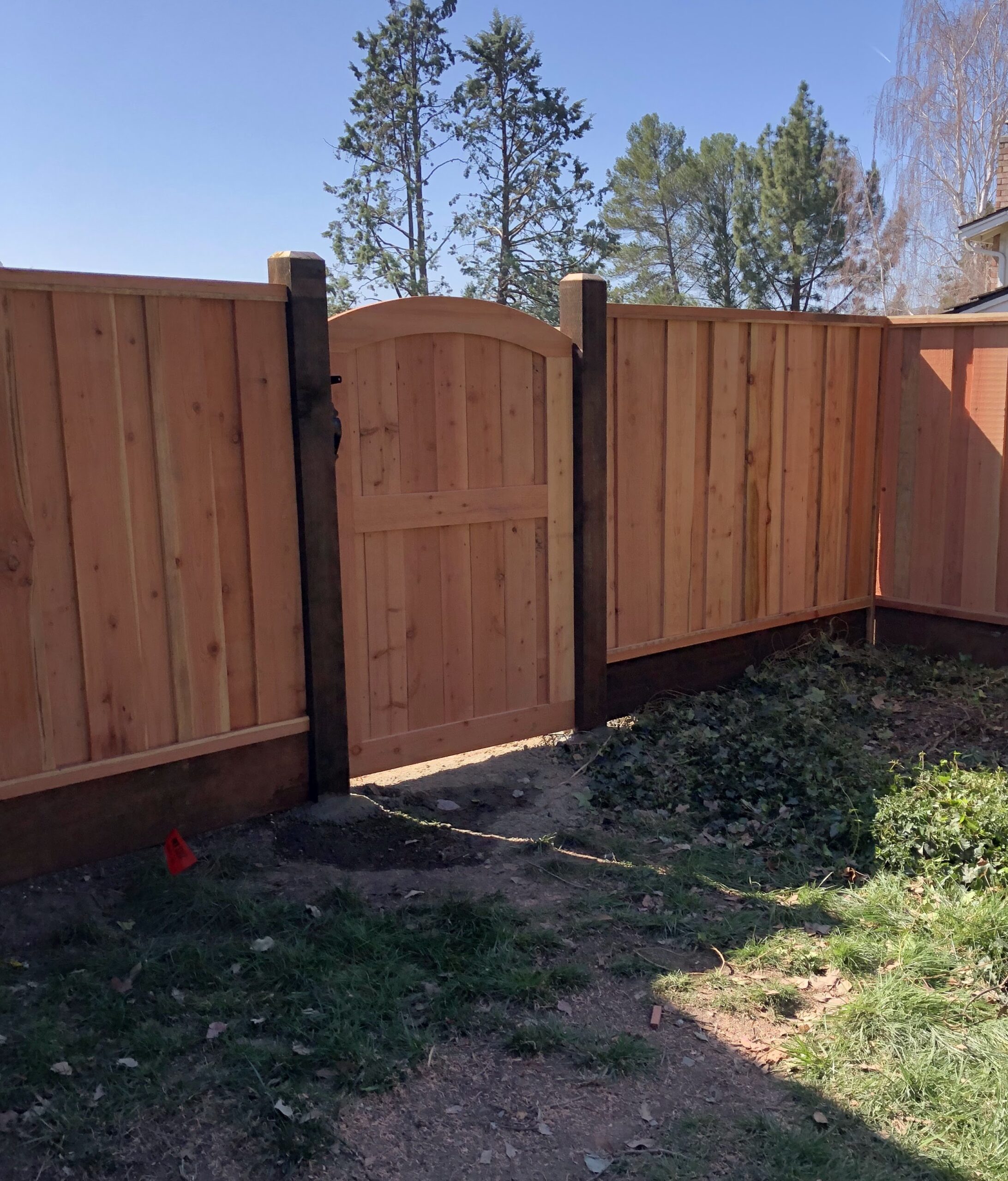 Picture of AMM Fencing installed this custom framed arch gate. - AMM Fencing