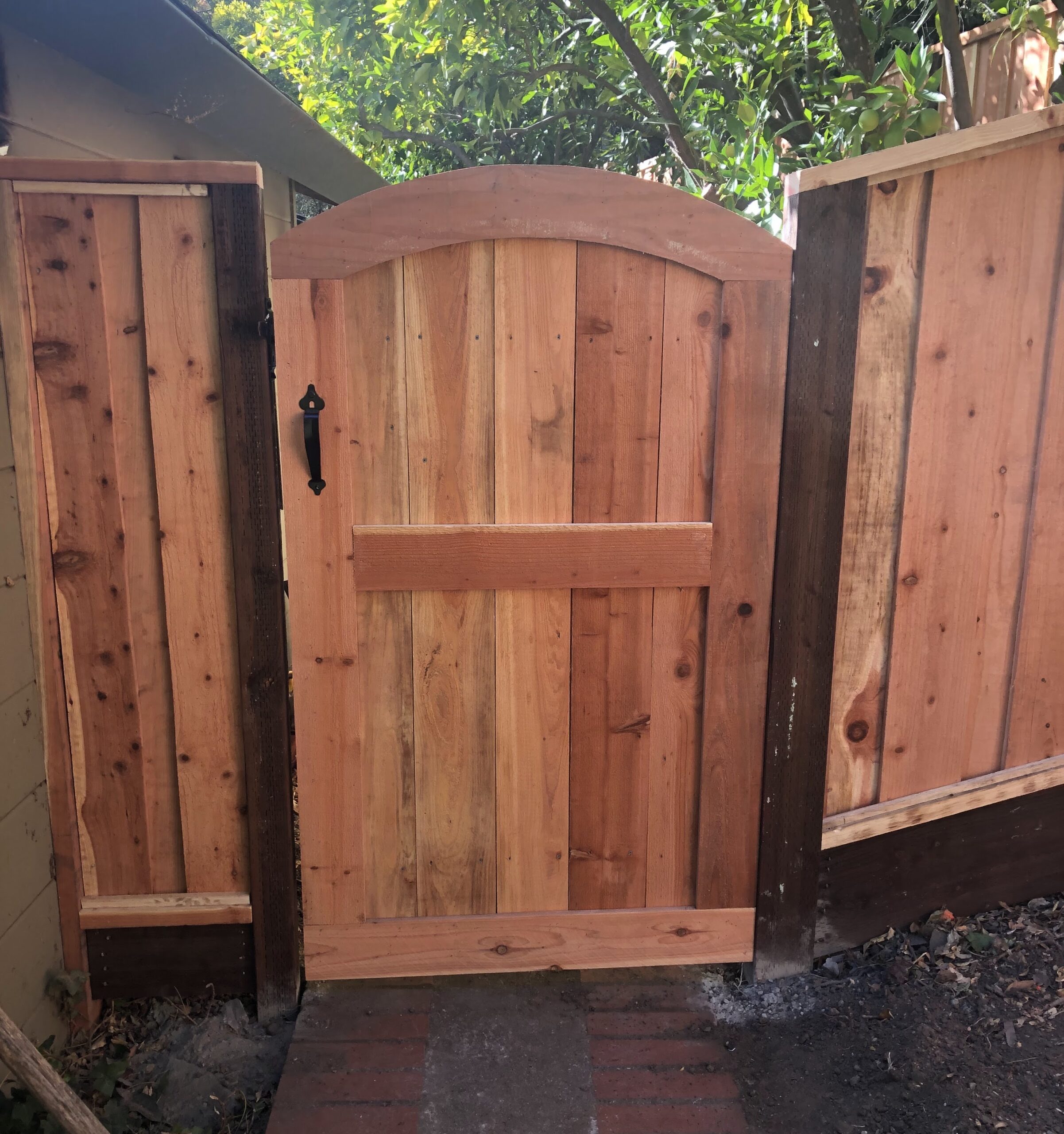 Picture of This redwood arch gate features a custom frame. - AMM Fencing