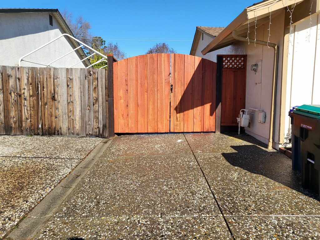 Picture of AMM Fencing installed this arched redwood gate. - AMM Fencing