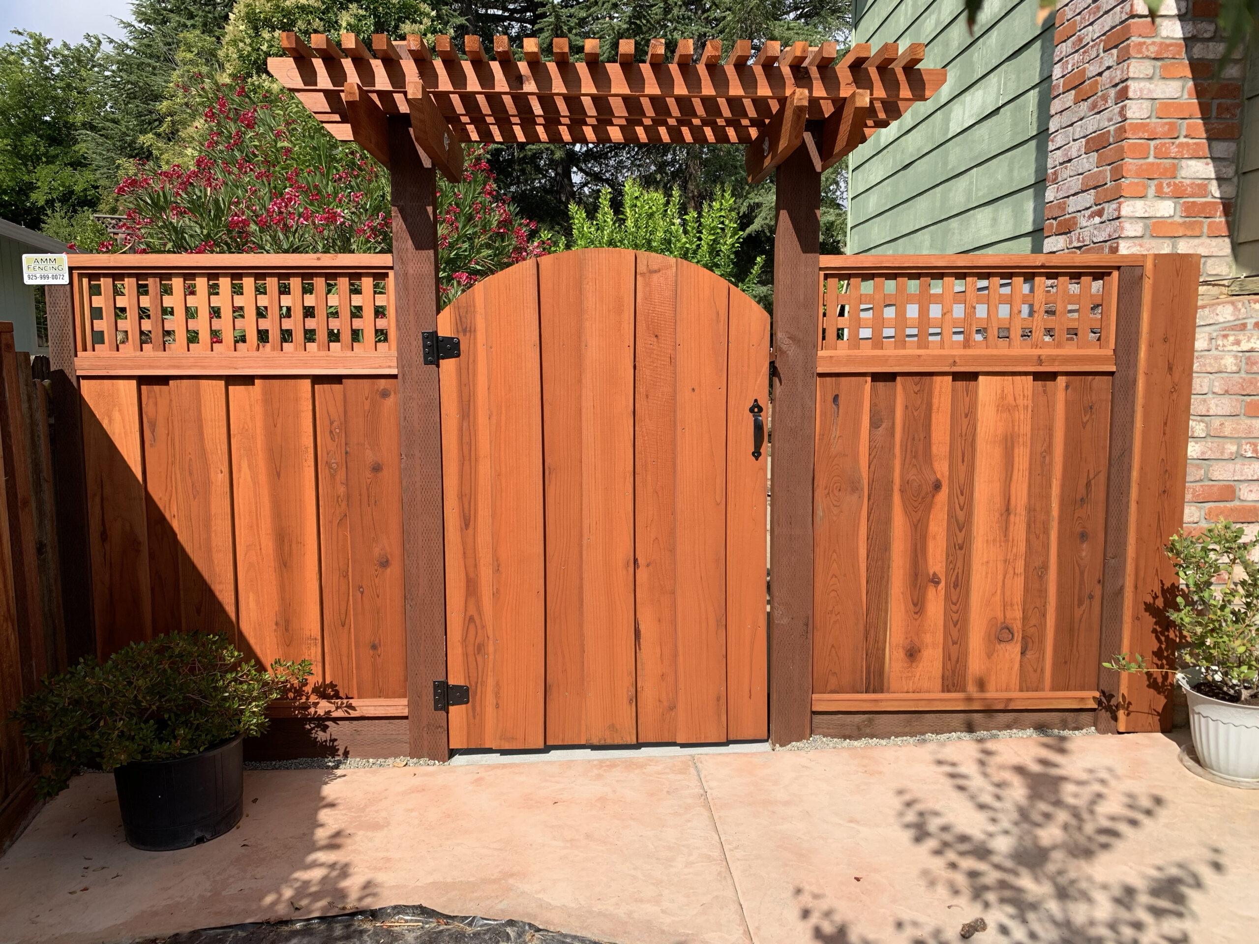 Picture of This square arched redwood gate features a lattice-style trellis. - AMM Fencing