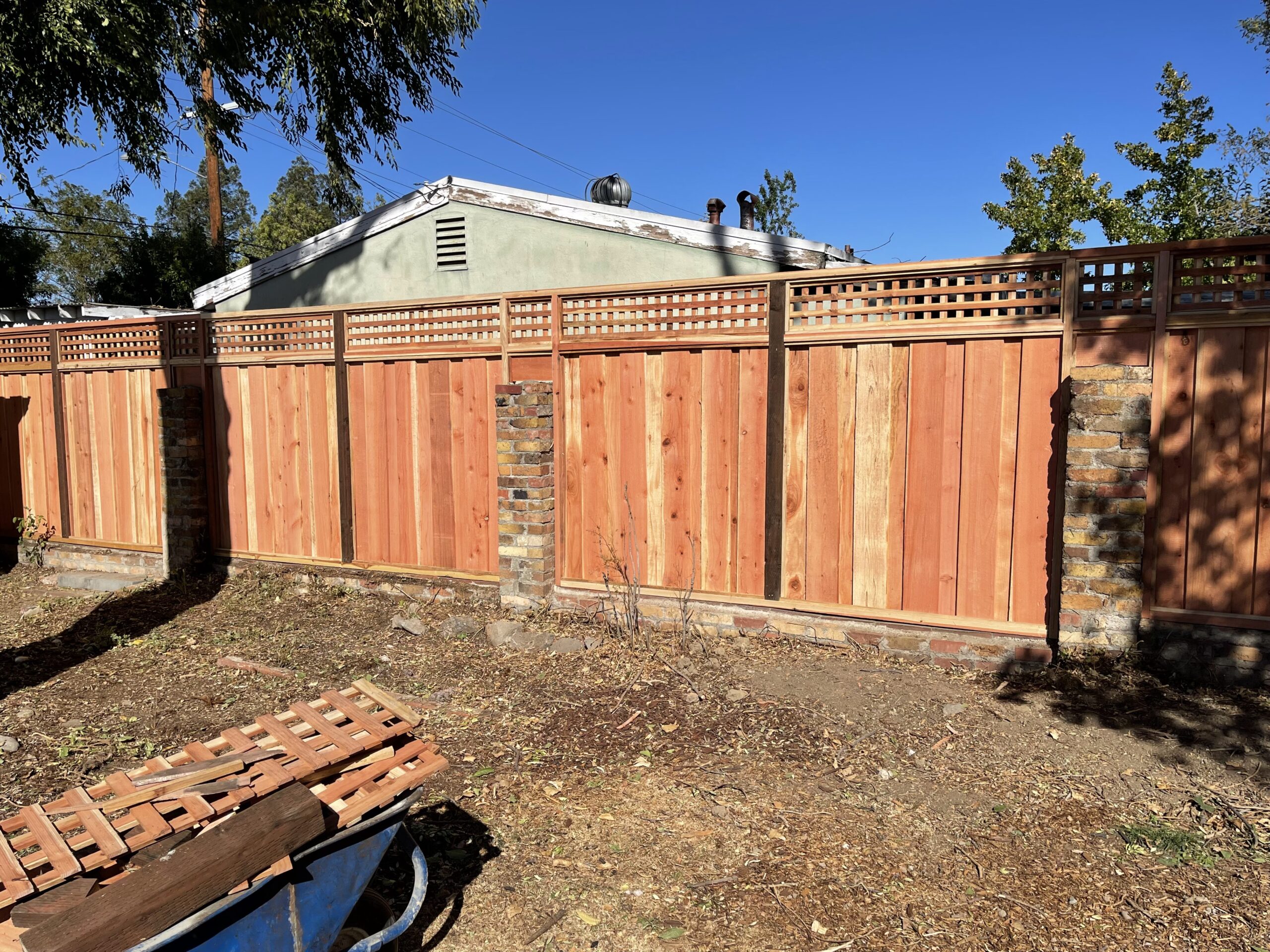 Picture of AMM Fencing installed this square lattice-style redwood fence. - AMM Fencing